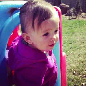 Too cute not to post (featuring one of Emma's first ponytails)