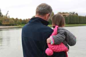Checking out huge fish, swans and ducks in the Grand Canal with Papa