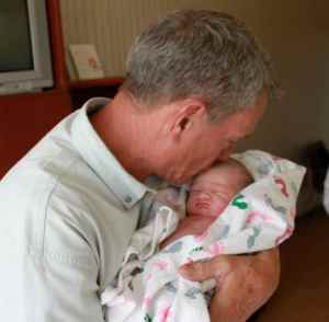 Papa's first time holding you and first kiss.